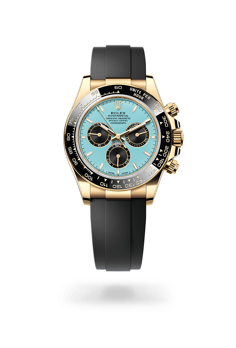 Rolex Cosmograph Daytona in 18 ct yellow gold with Turquoise blue and black dial, Black monobloc Cerachrom bezel in ceramic with moulded tachymetric scale bezel, and Flexible metal blades overmoulded with high-performance elastomer bracelet
