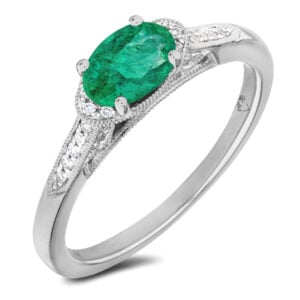 Oval Cut Emerald and Canadian Diamond Ring in White Gold | 0.58 Carat