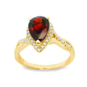 Pear Shaped Garnet and Canadian Diamond Halo Twist Ring in Yellow Gold