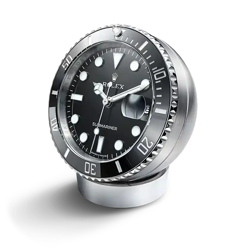 Rolex Submariner desk clock in stainless steel, with a Cerachrom bezel insert and Chromalight display, incorporates a secular calendar.