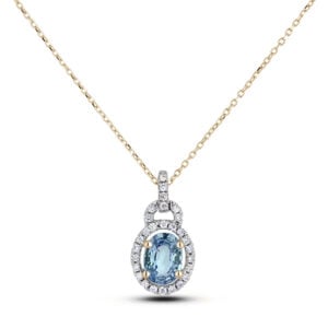 Oval Shaped Aquamarine and Canadian Diamond Halo Pendant in Yellow
