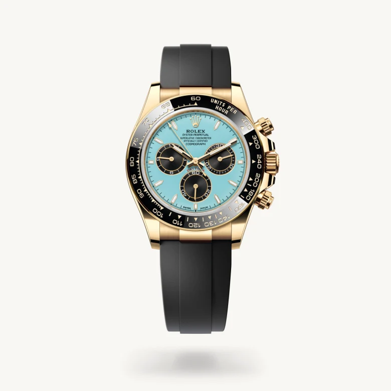 Rolex Cosmograph Daytona in 18 ct yellow gold with Turquoise blue and black dial, Black monobloc Cerachrom bezel in ceramic with moulded tachymetric scale bezel, and Flexible metal blades overmoulded with high-performance elastomer bracelet
