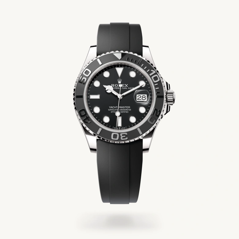 Rolex Yacht-Master 42 in 18 ct white gold with Black dial, Bidirectional rotatable 60-minute graduated bezel with matt black Cerachrom insert in ceramic, polished raised numerals and graduations bezel, and Flexible metal blades overmoulded with high-performance elastomer bracelet
