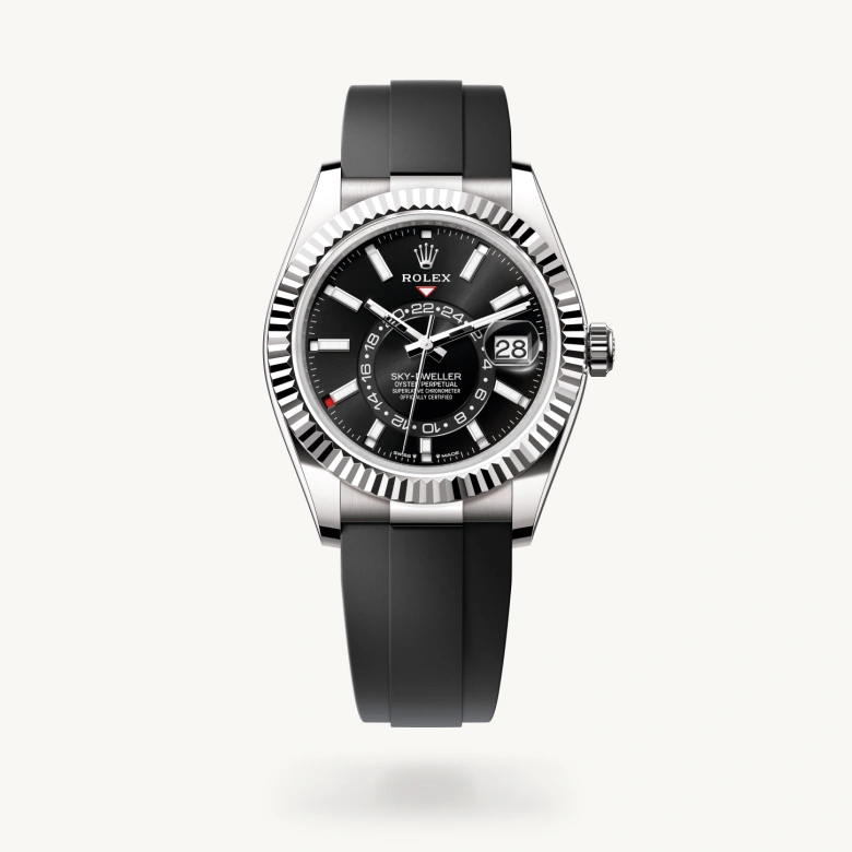 Rolex Sky-Dweller in 18 ct white gold with Bright black dial, Fluted, bidirectional rotatable Rolex Ring Command bezel, and Flexible metal blades overmoulded with high-performance elastomer bracelet